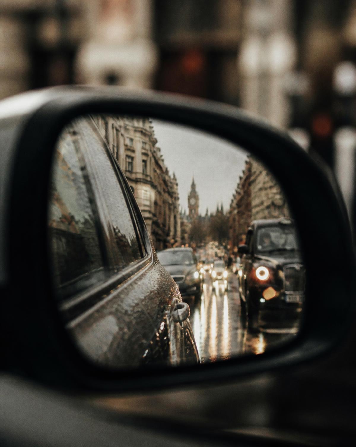 London traffic seen in a car wing mirror