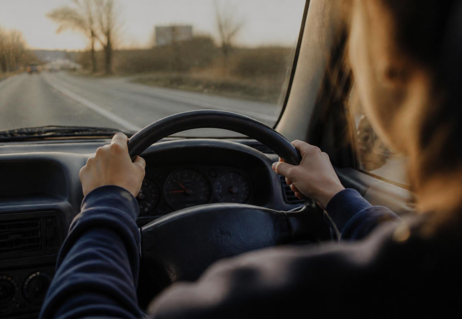 Learner's hands on the wheel during a driving lesson